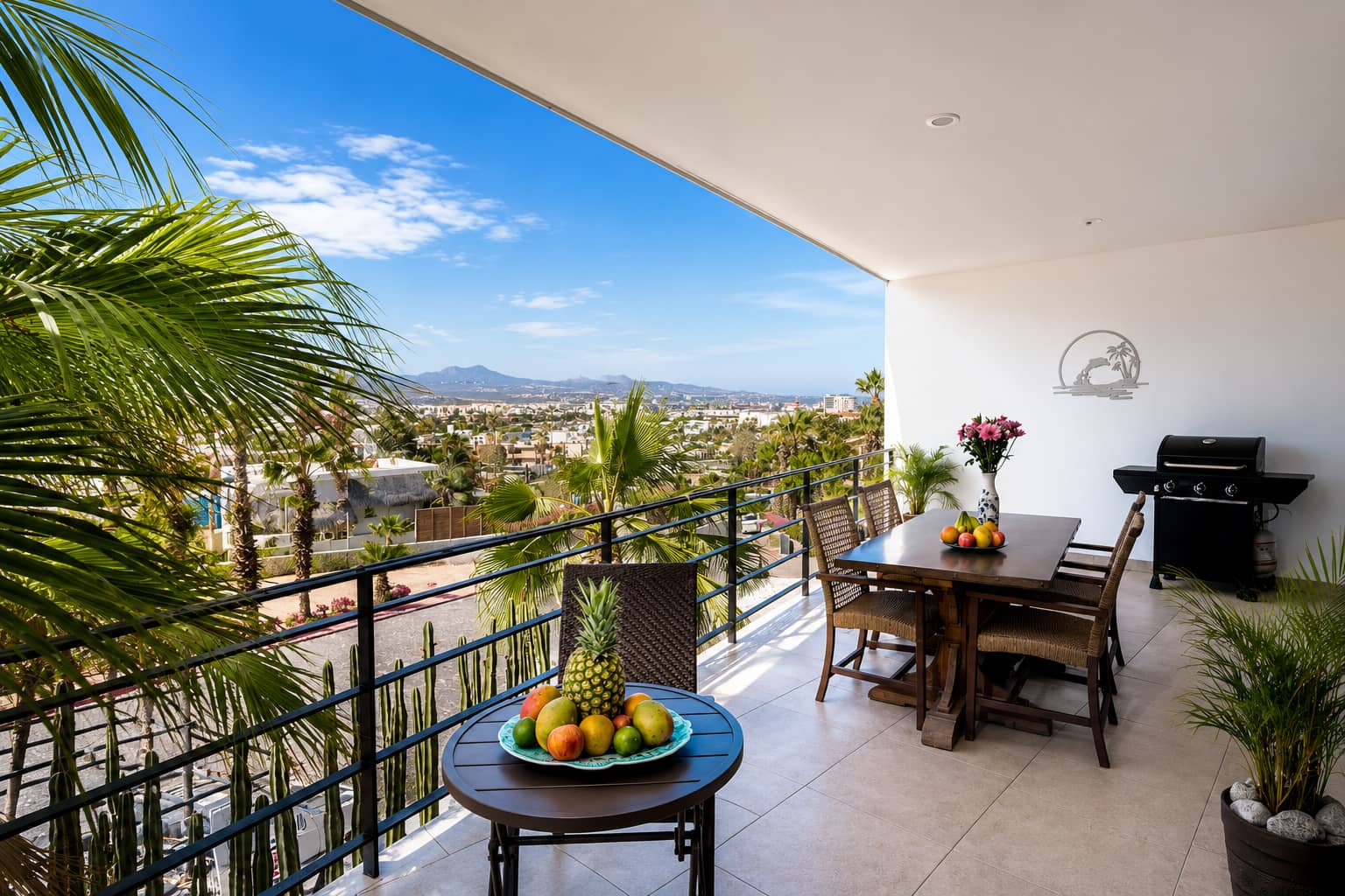 Private terrace with dining table and view of Cabo San Lucas
