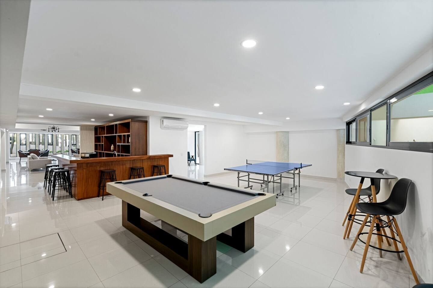 Game room with pool table and bar at Pedregal Towers