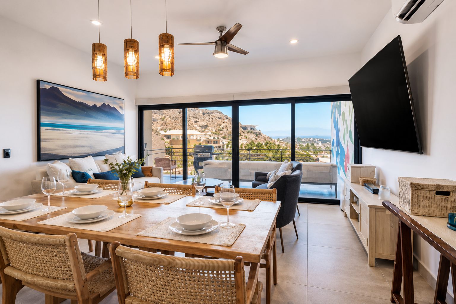 Dining table beside the open terrace doors