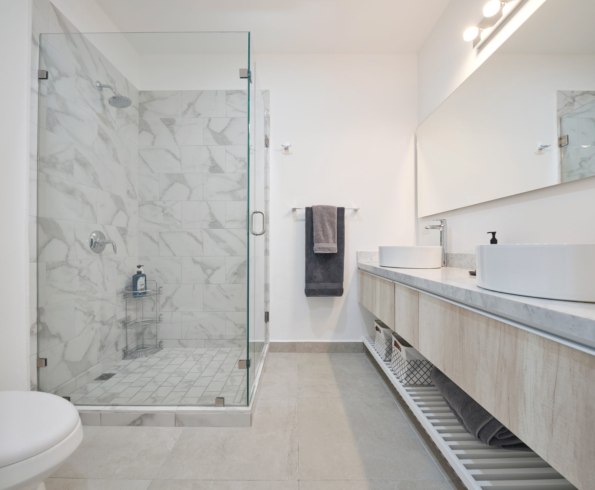 Primary bathroom with walk-in shower and double vanity