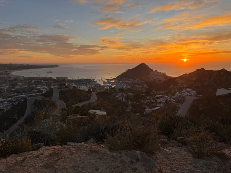 From the top of the Pedregal hike — Medano Beach and downtown Cabo San Lucas visible from Pedregal Towers
