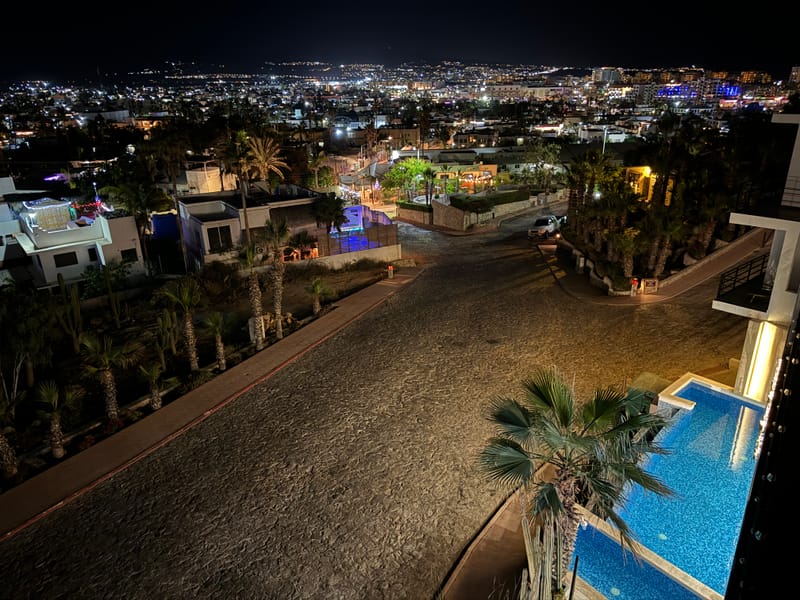 Pedregal at night — city lights below the Cabo San Lucas Airbnb community