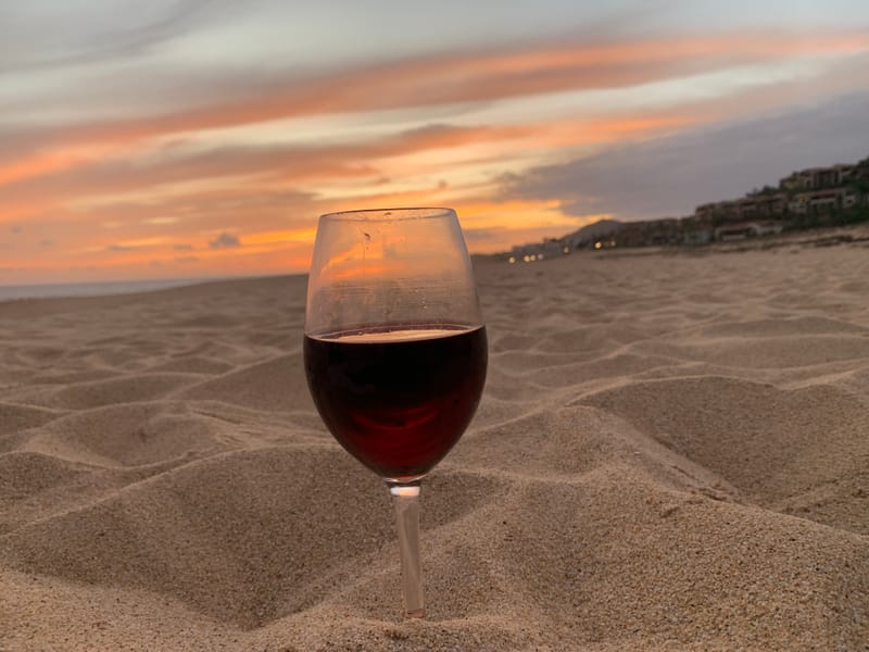 Sunset wine on Pedregal beach — the reason our guests book the Airbnb a second time